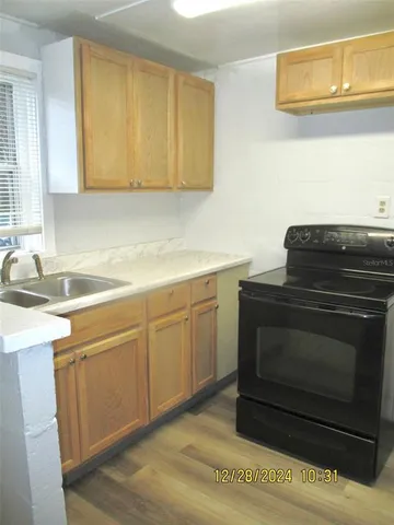 a kitchen with a stove and a sink