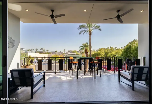 a room with furniture a flat screen tv and a window