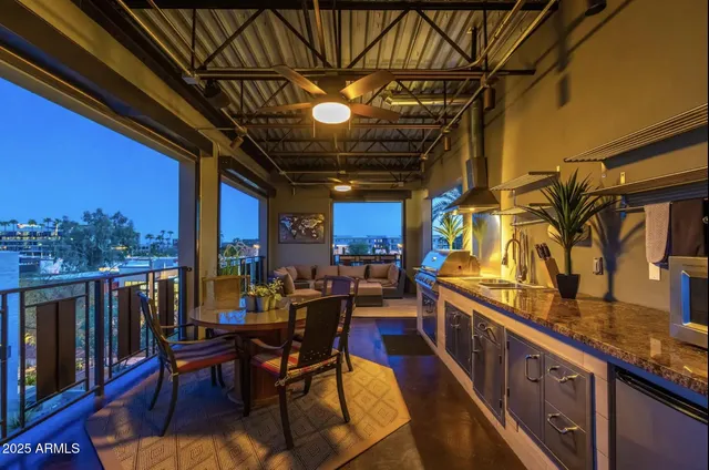 a living room with furniture a rug and a window