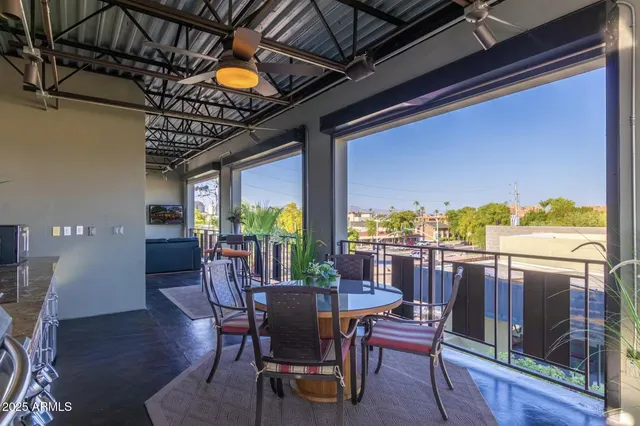 a kitchen with stainless steel appliances granite countertop a stove a sink dishwasher and cabinets with wooden floor