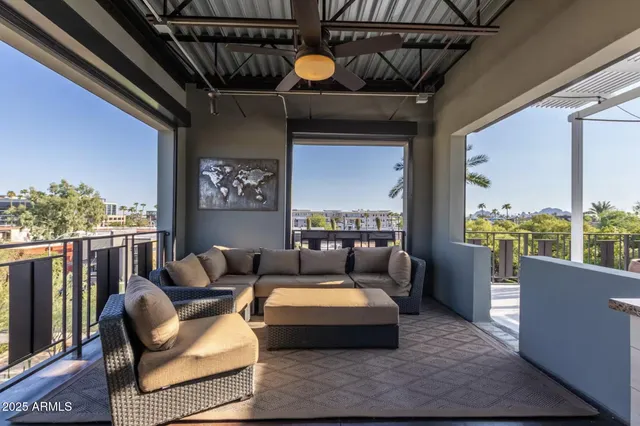 a view of a balcony with chairs