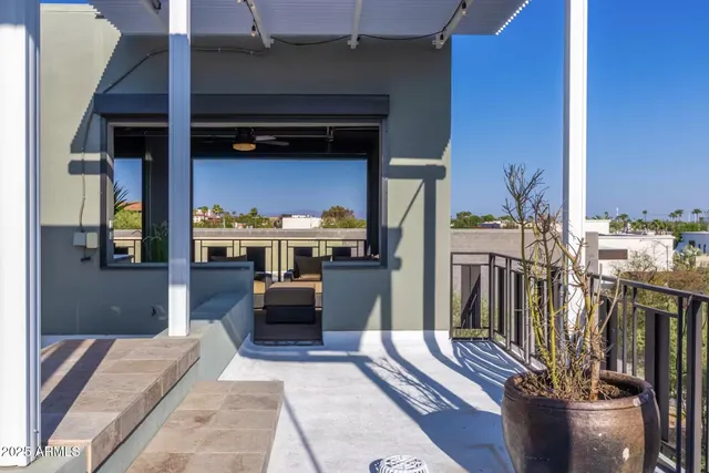a view of a chairs and tables in the terrace