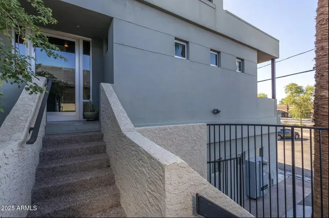 a view of a building with a mountain in the background