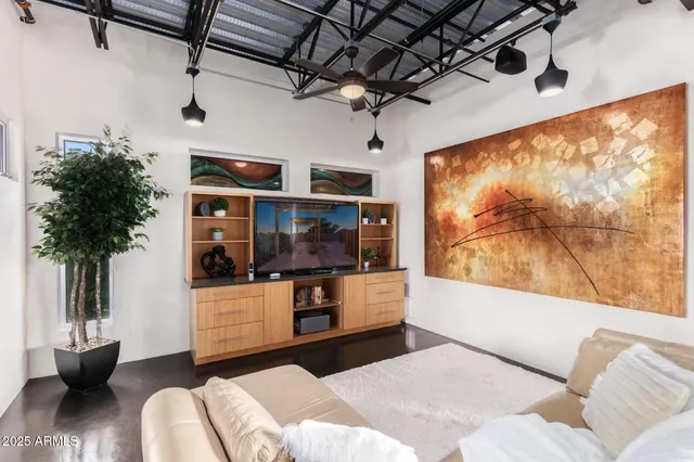 a outdoor living space with patio furniture and a chandelier