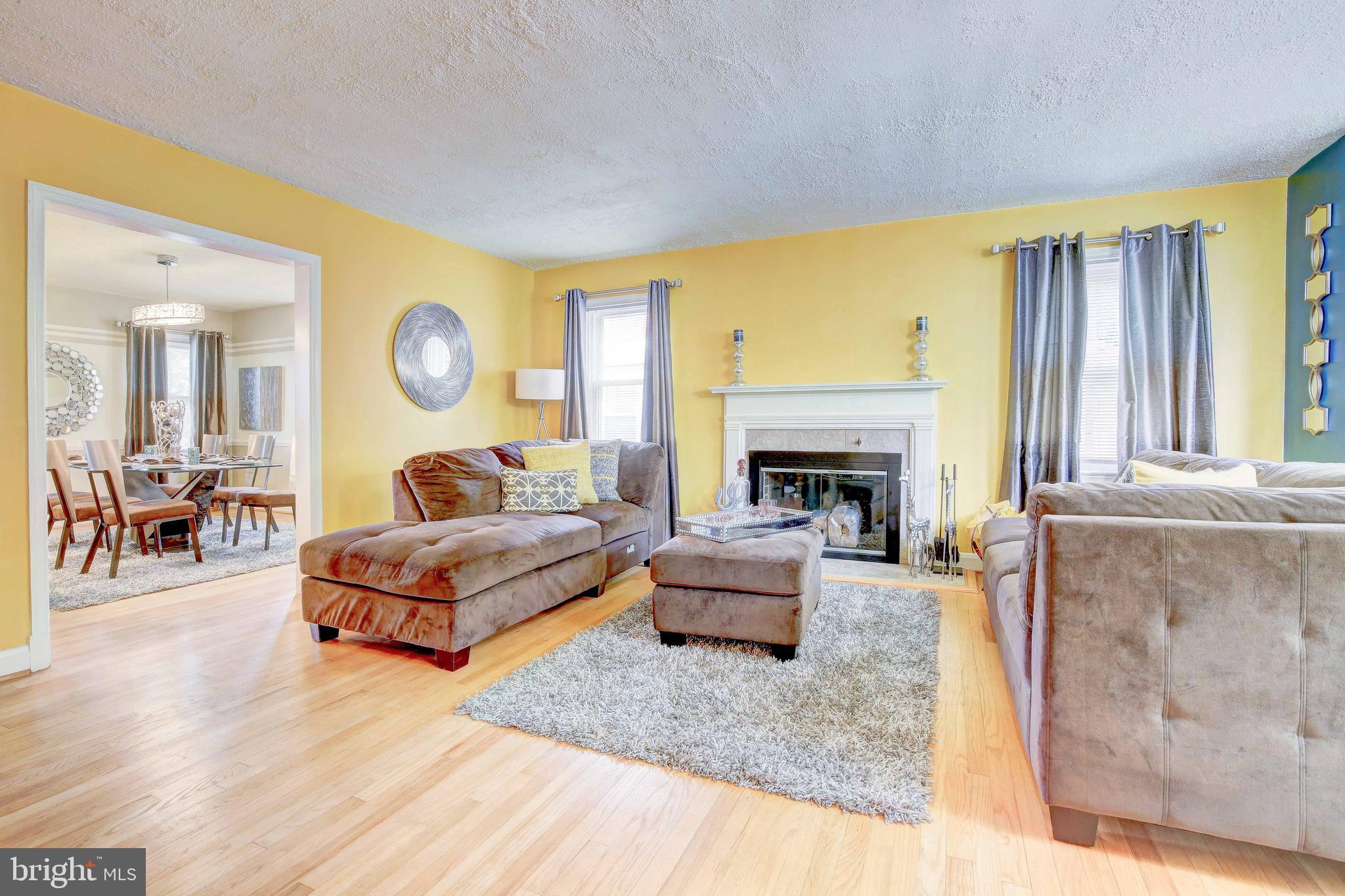 1543 Northbourne Road Baltimore, MD 21239 - Photo 3 of 20 a living room with furniture and a fireplace