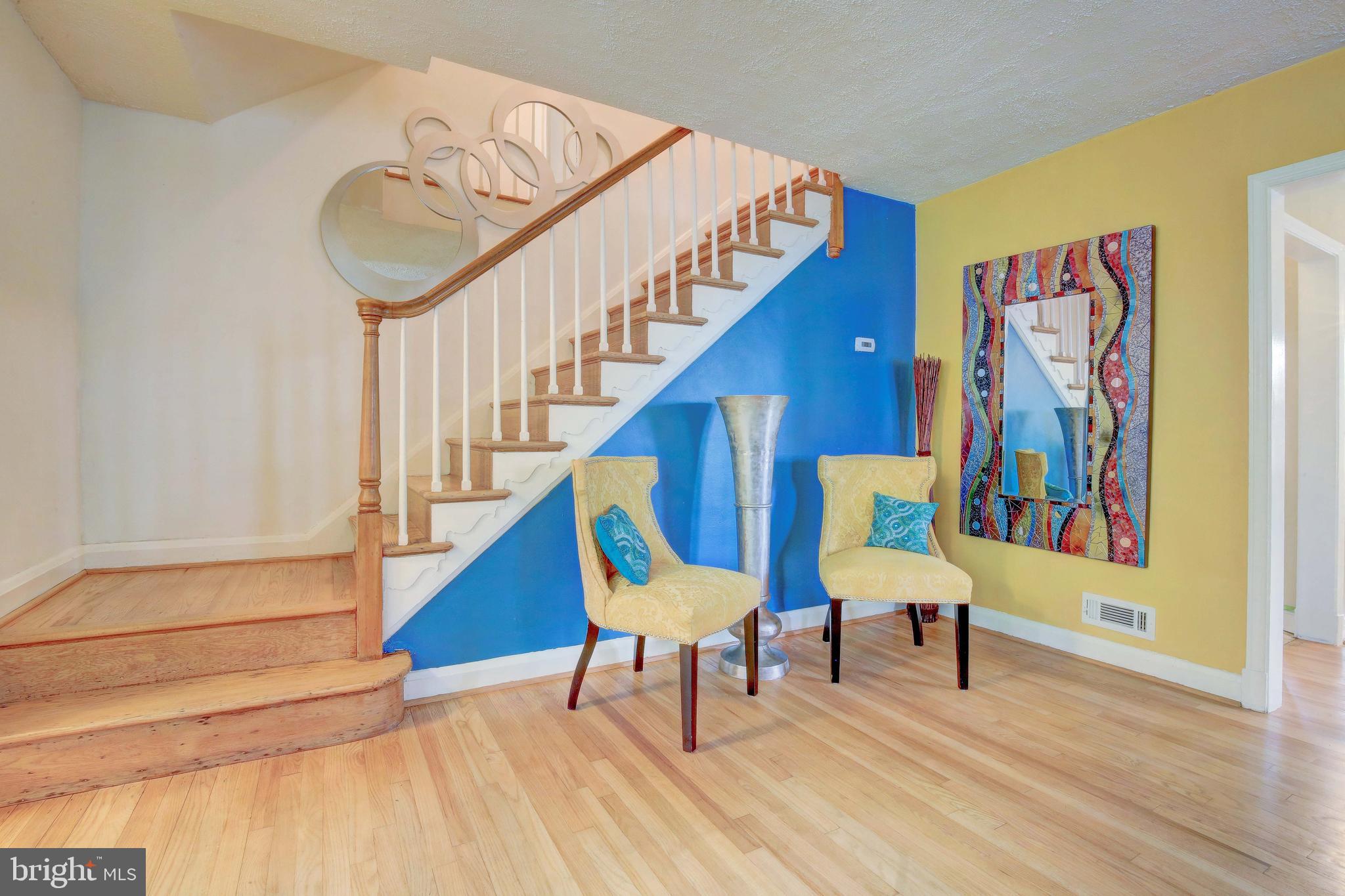 1543 Northbourne Road Baltimore, MD 21239 - Photo 4 of 20 a living room with furniture and a stairs