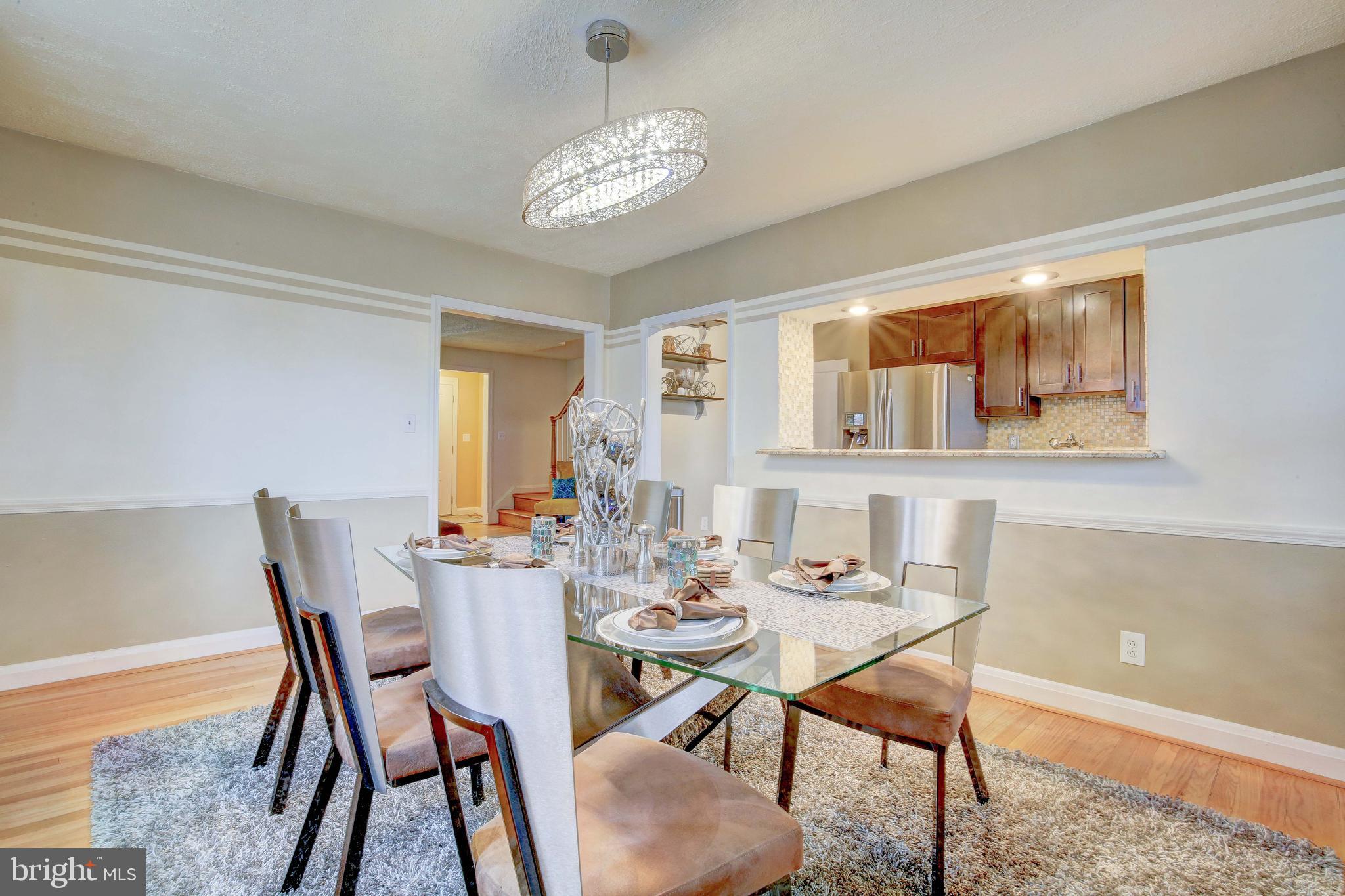 1543 Northbourne Road Baltimore, MD 21239 - Photo 8 of 20 a view of a dining room with furniture