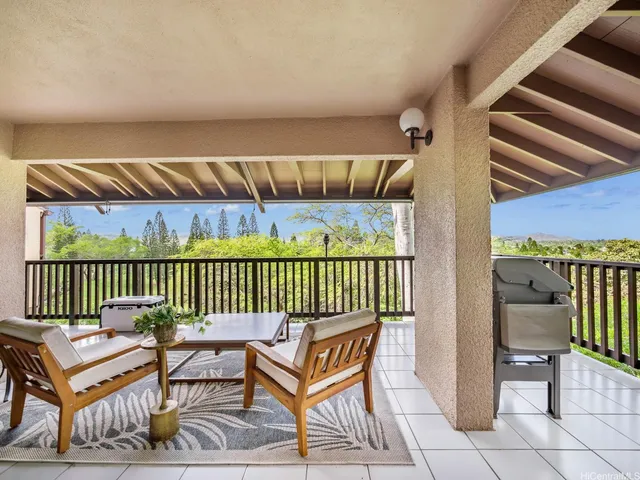 a outdoor space with the couches and dining table with the garden view