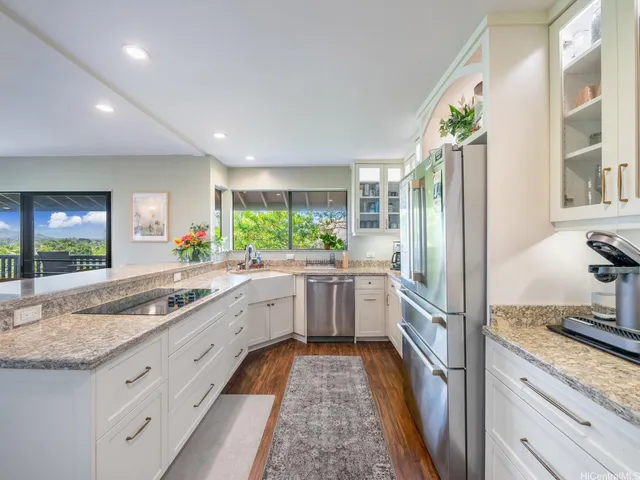 a kitchen with a sink stove and cabinets