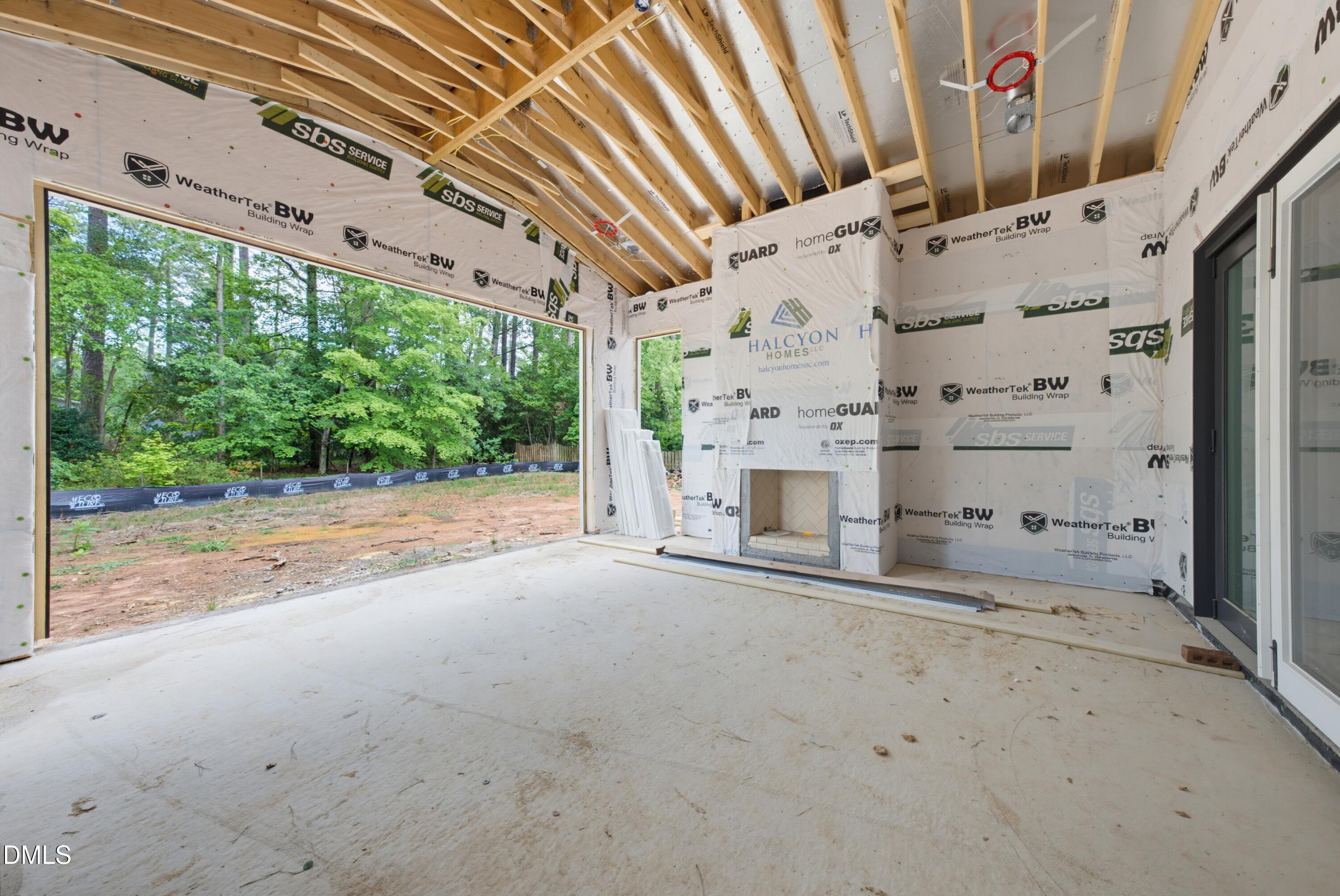 7508 Grist Mill Road Raleigh, NC 27615 - Photo 25 of 32 a view of a patio with table and chairs and garden