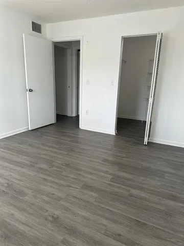 a kitchen with stainless steel appliances a stove a sink and a refrigerator