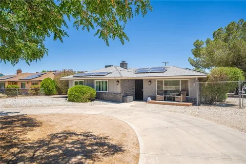 a front view of a house with yard