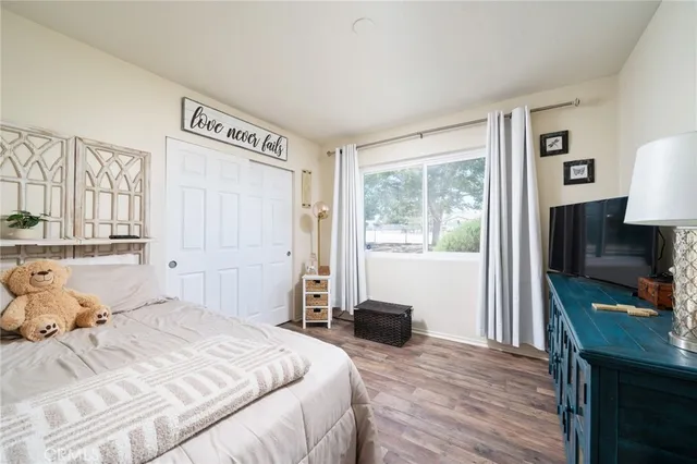 a view of a livingroom with workspace and a window