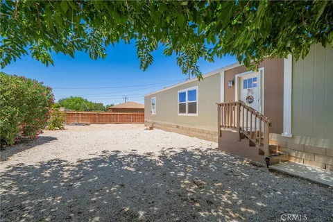 a kitchen with a stove a refrigerator and a sink