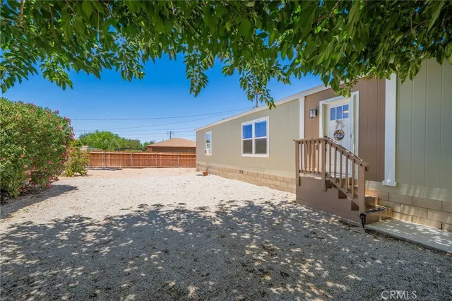 a kitchen with a stove a refrigerator and a sink