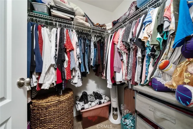 a view of a porch with a table and chairs