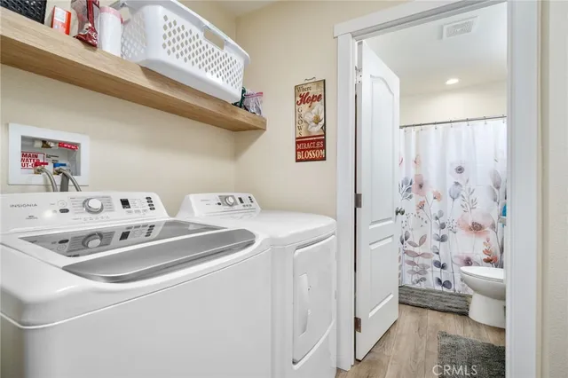 a view of a street with trees and buildings in the background