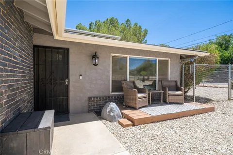 a view of kitchen with furniture and a fireplace