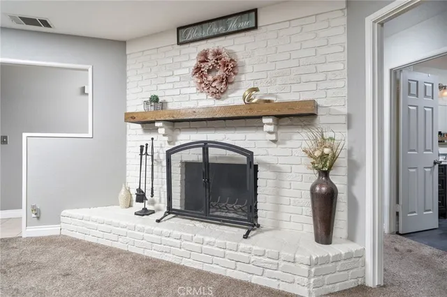 a kitchen with kitchen island granite countertop a sink stainless steel appliances and cabinets