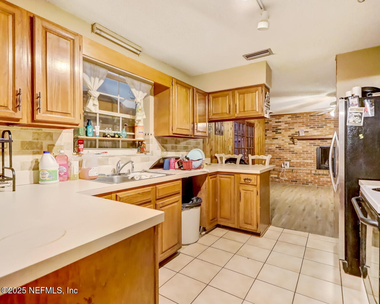 43059 Pearl Lane Callahan, FL 32011 - Photo 13 of 42 a kitchen with a sink appliances and cabinets