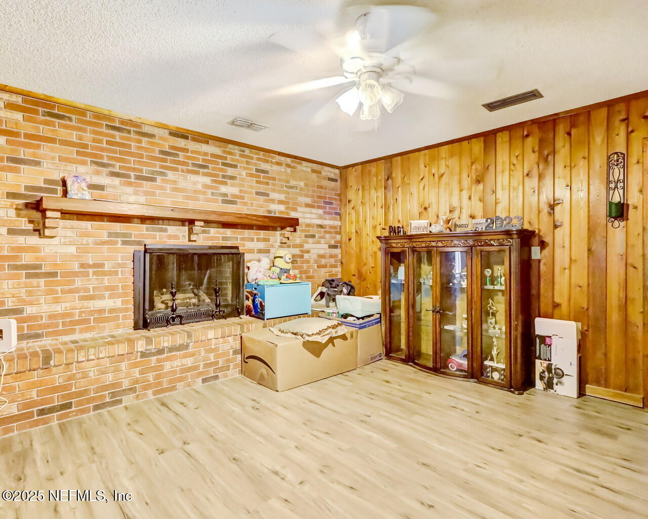 43059 Pearl Lane Callahan, FL 32011 - Photo 17 of 42 a view of a bedroom with wooden floor and a large window