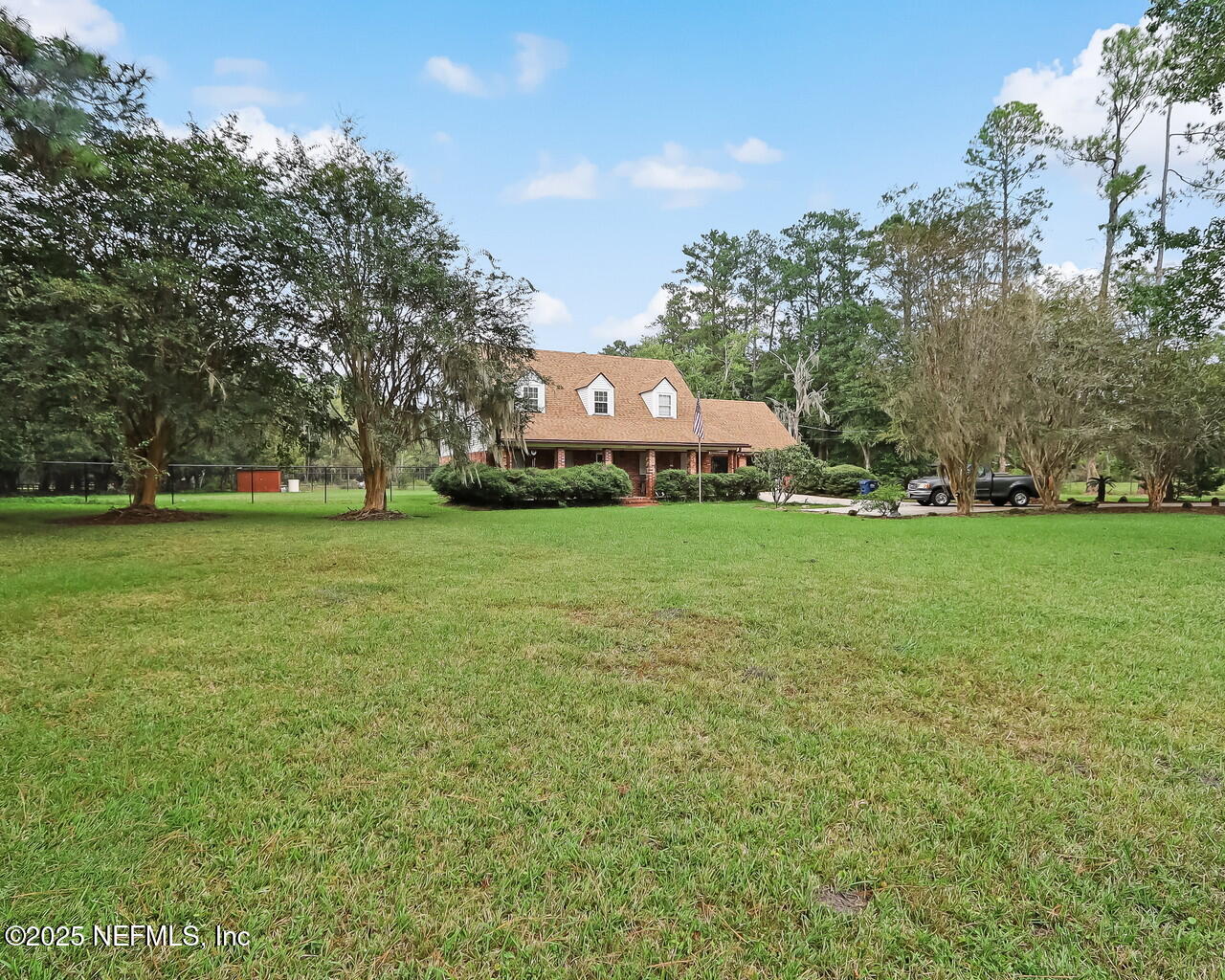 43059 Pearl Lane Callahan, FL 32011 - Photo 2 of 42 a front view of a house with garden