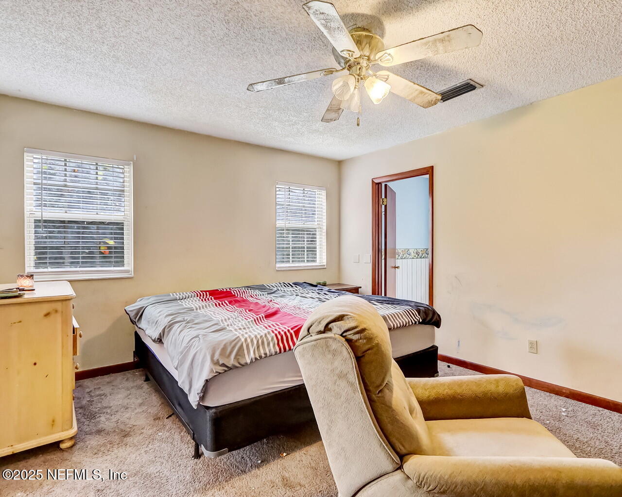 43059 Pearl Lane Callahan, FL 32011 - Photo 21 of 42 a bedroom with a bed and window