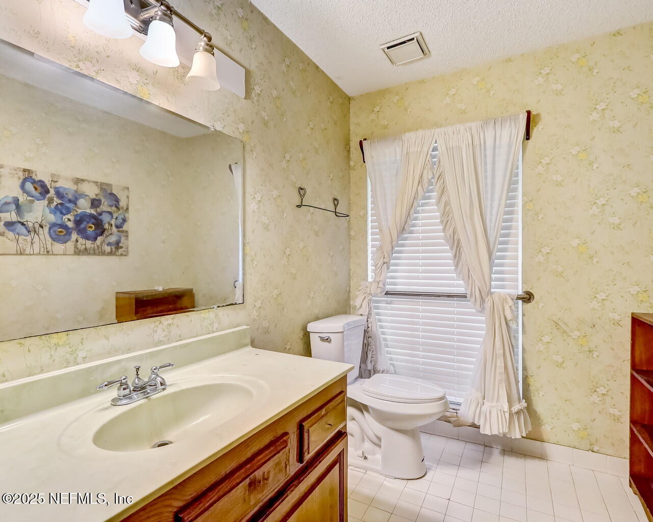 43059 Pearl Lane Callahan, FL 32011 - Photo 27 of 42 a bathroom with a sink toilet and shower