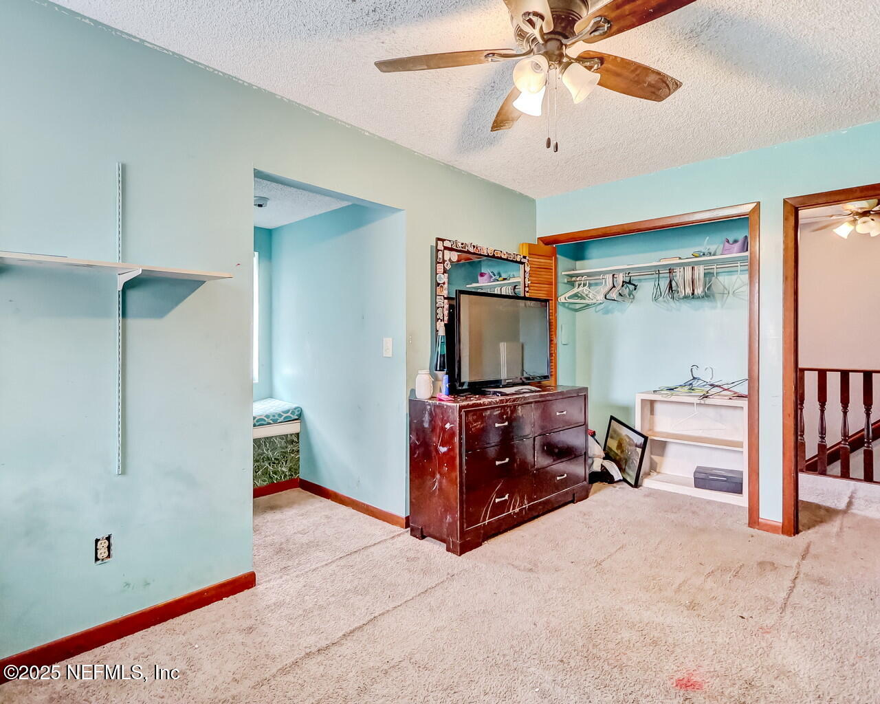 43059 Pearl Lane Callahan, FL 32011 - Photo 29 of 42 a living room with furniture and a flat screen tv