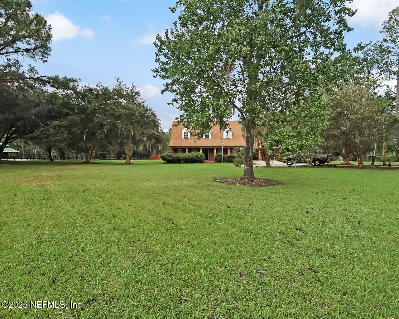 43059 Pearl Lane Callahan, FL 32011 - Photo 3 of 42 a garden with trees in the background