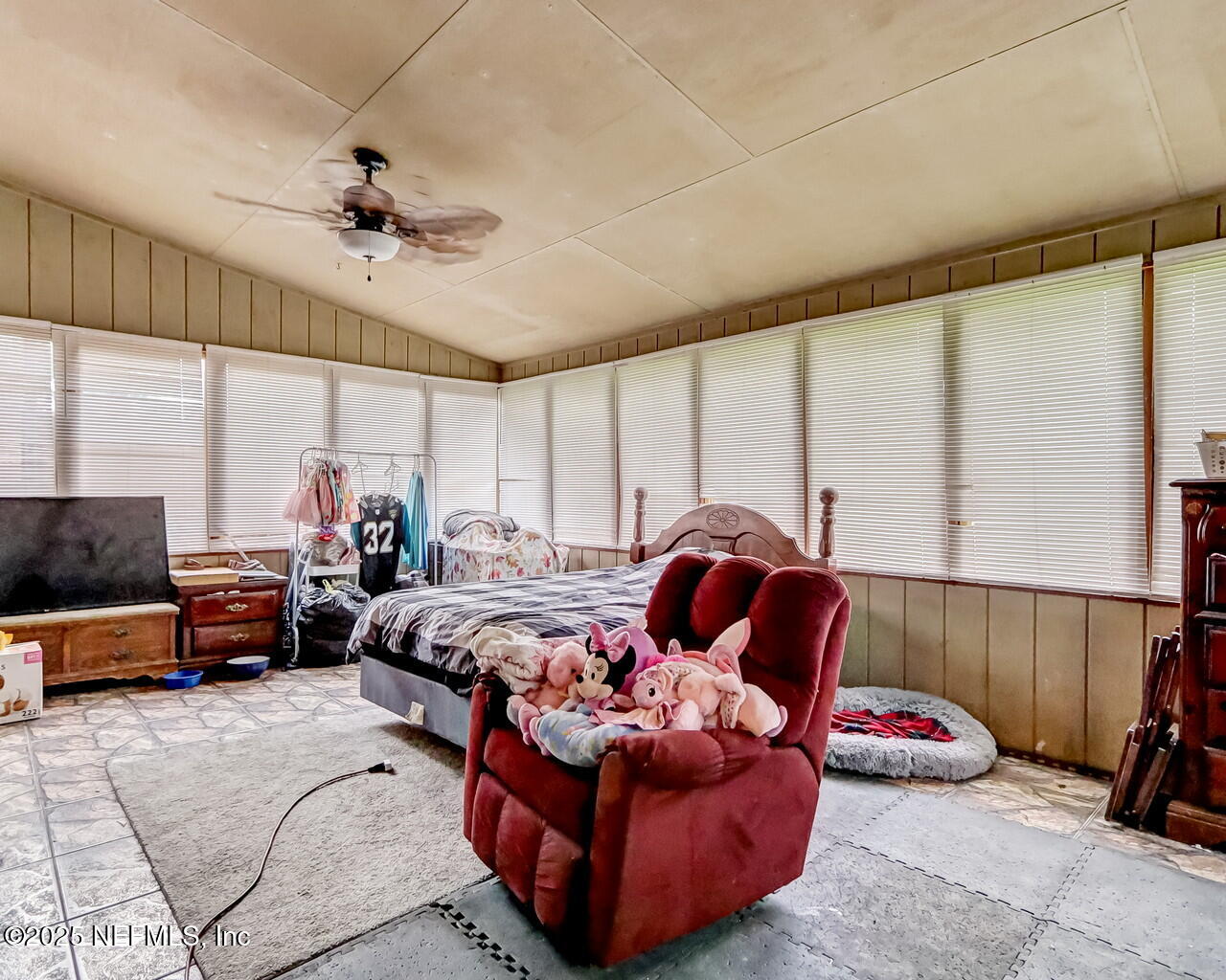 43059 Pearl Lane Callahan, FL 32011 - Photo 31 of 42 a bedroom with furniture and a large window