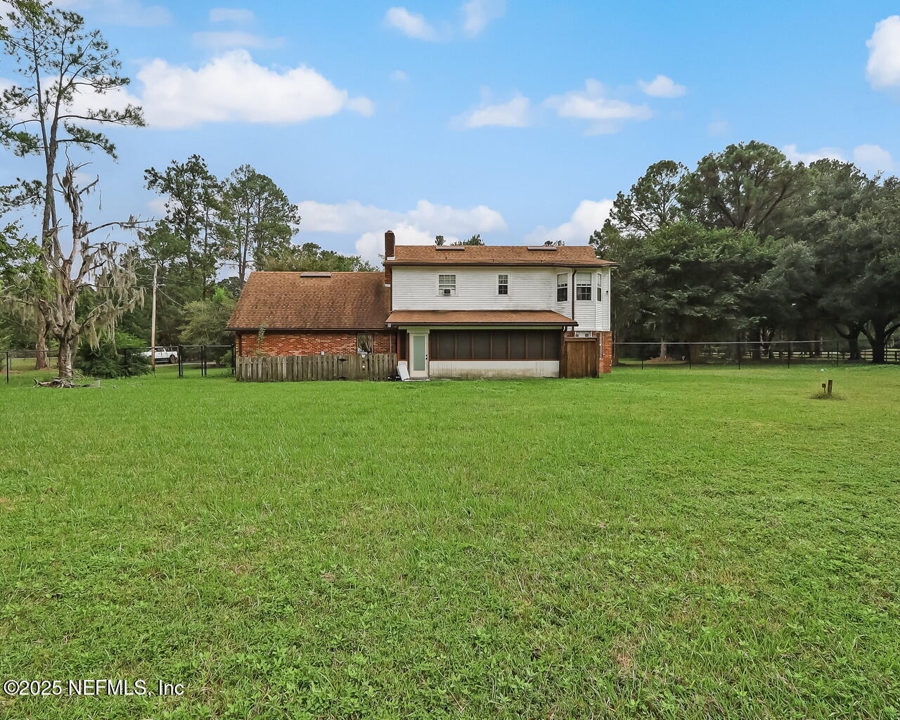 43059 Pearl Lane Callahan, FL 32011 - Photo 34 of 42 a view of a house with a big yard and large trees