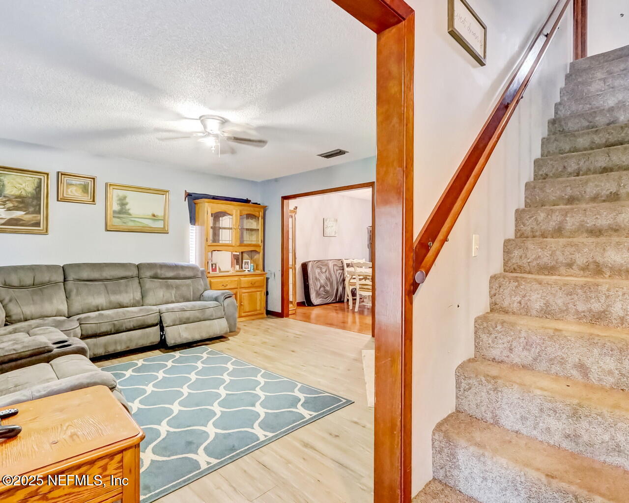 43059 Pearl Lane Callahan, FL 32011 - Photo 6 of 42 a view of a livingroom with furniture and staircase
