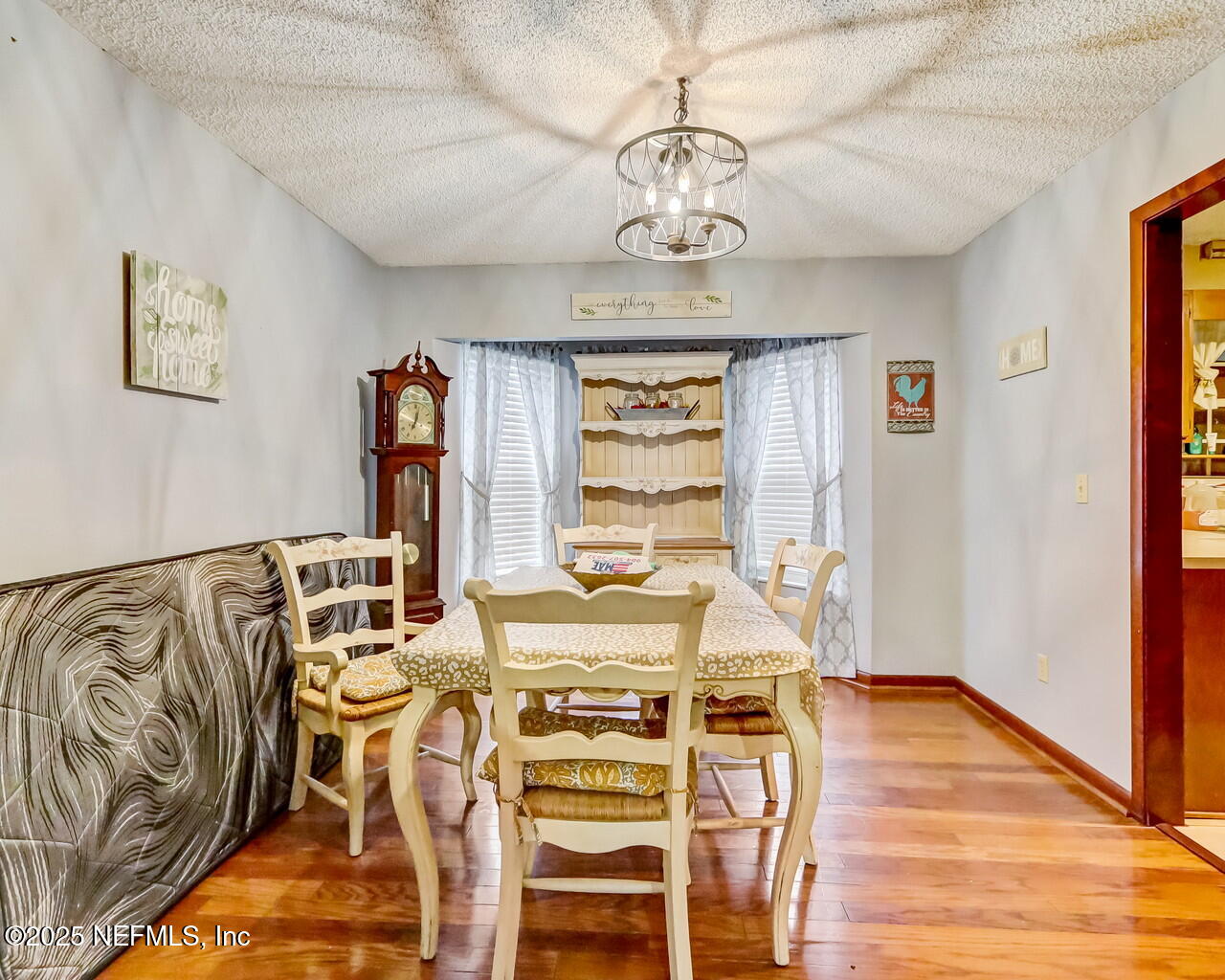 43059 Pearl Lane Callahan, FL 32011 - Photo 10 of 42 a view of a dining room with furniture window and wooden floor