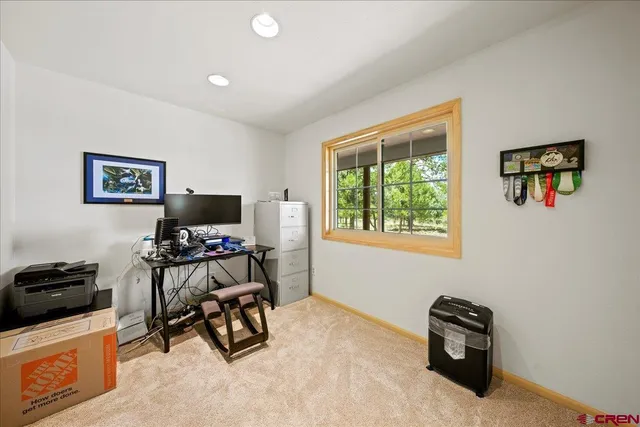 a bedroom with a workspace