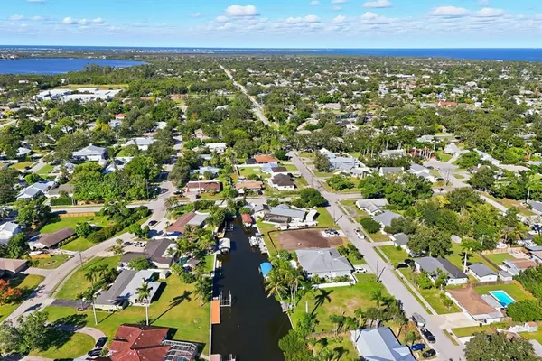 an aerial view of residential houses with outdoor space