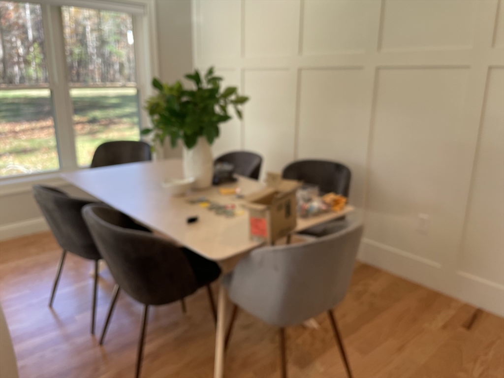 22 Barracks Road, Unit 22 Hudson, MA 01749 - Photo 6 of 15 a view of a dining room with furniture and window