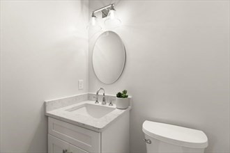 22 Barracks Road, Unit 22 Hudson, MA 01749 - Photo 8 of 15 a bathroom with a toilet sink and mirror