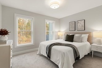 22 Barracks Road, Unit 22 Hudson, MA 01749 - Photo 9 of 15 a bedroom with a bed and a window