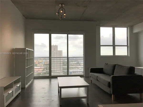 a view of an empty room and window