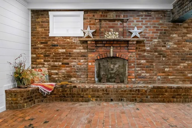 a view of a fireplace with a glass door
