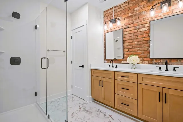 a bathroom with a shower and toilet