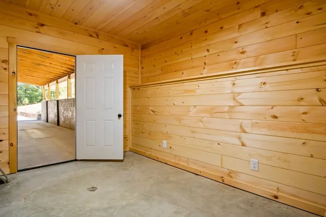 front view of a building with a garden