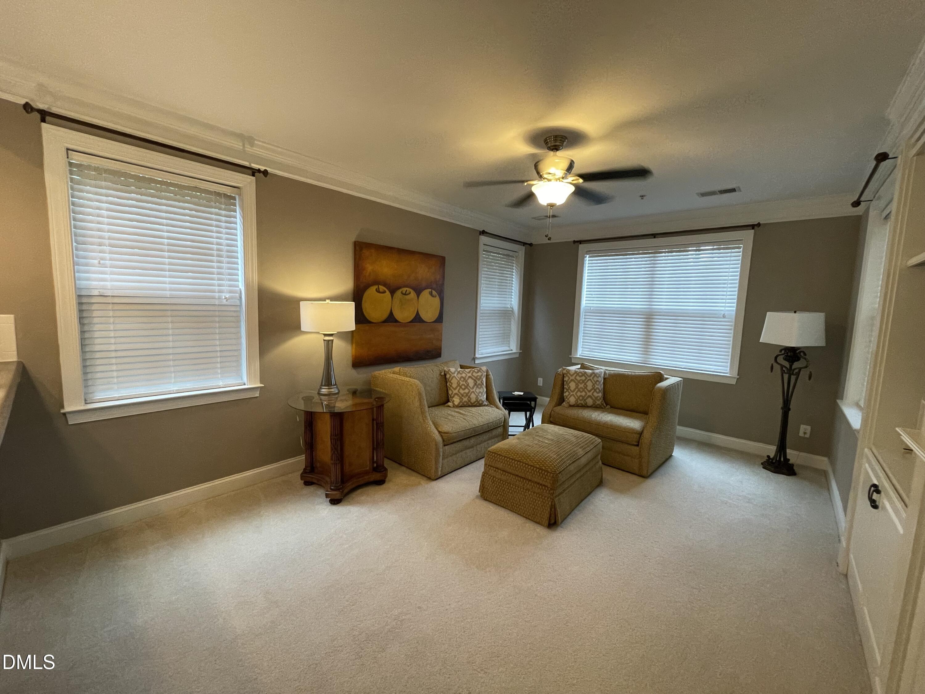 10411 Rosegate Court, Unit 3 Raleigh, NC 27617 - Photo 7 of 62 a living room with furniture and a window
