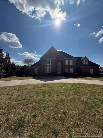 a front view of a house with a yard