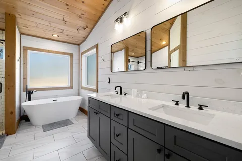 a bathroom with a toilet a sink and shower
