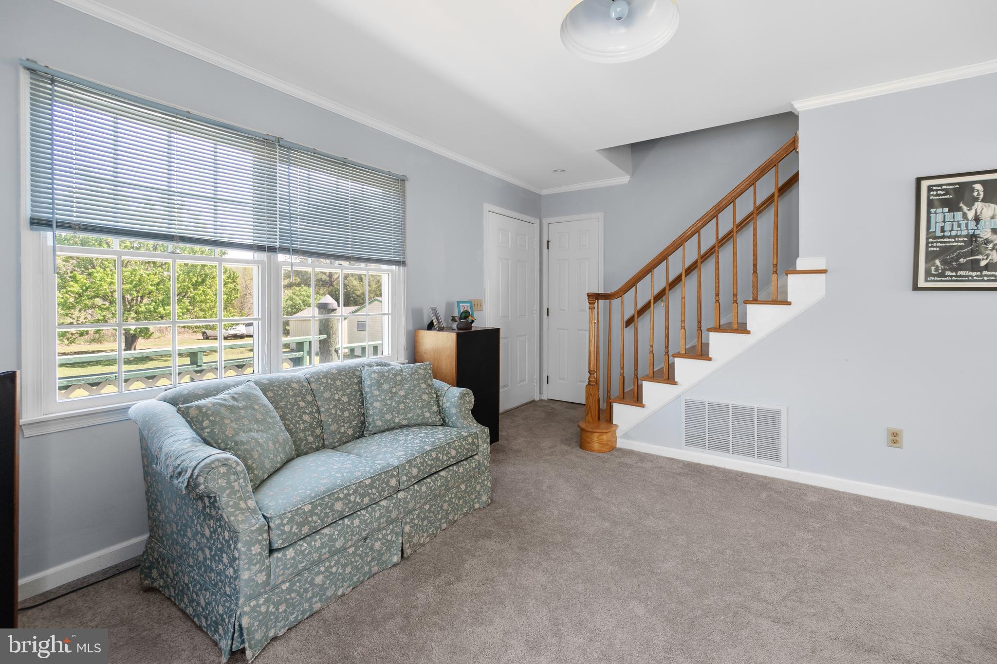 20128 Nanticoke Road Nanticoke, MD 21840 - Photo 54 of 70 a living room with furniture and a large window