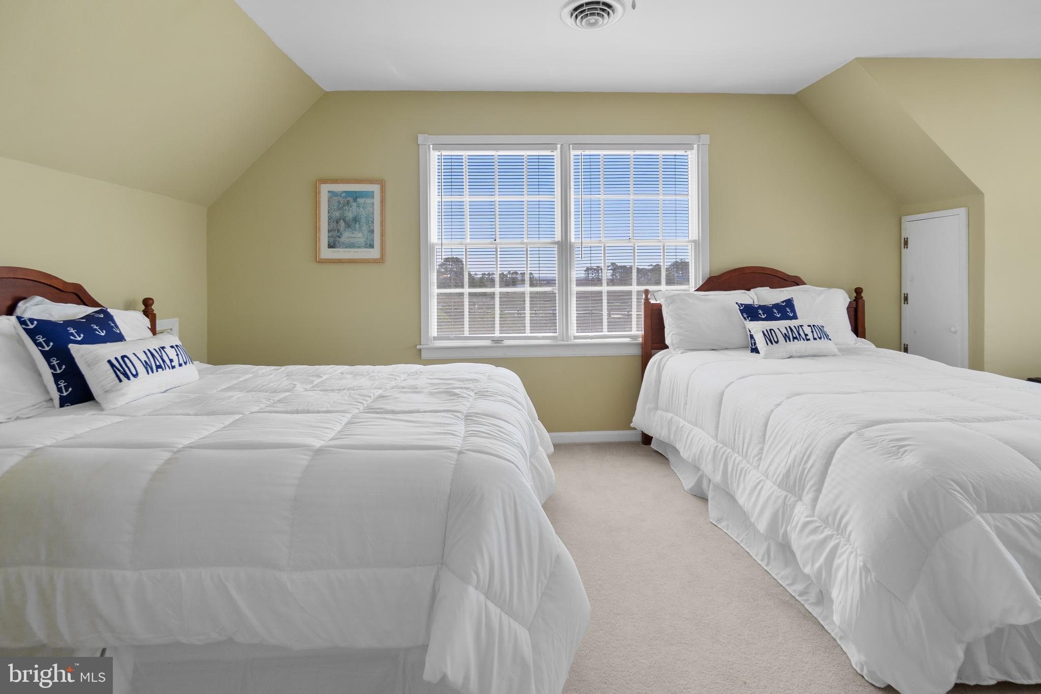 20128 Nanticoke Road Nanticoke, MD 21840 - Photo 66 of 70 a bedroom with a bed and a large window
