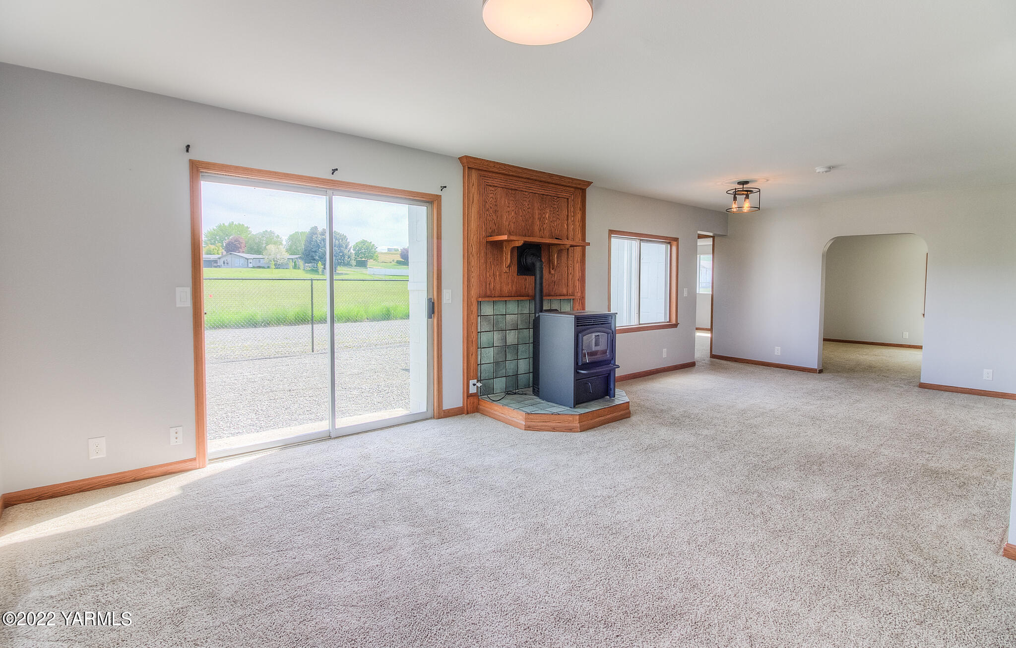 1212 Dazet Road Yakima, WA 98908 - Photo 4 of 37 a view of empty room with a fireplace and window