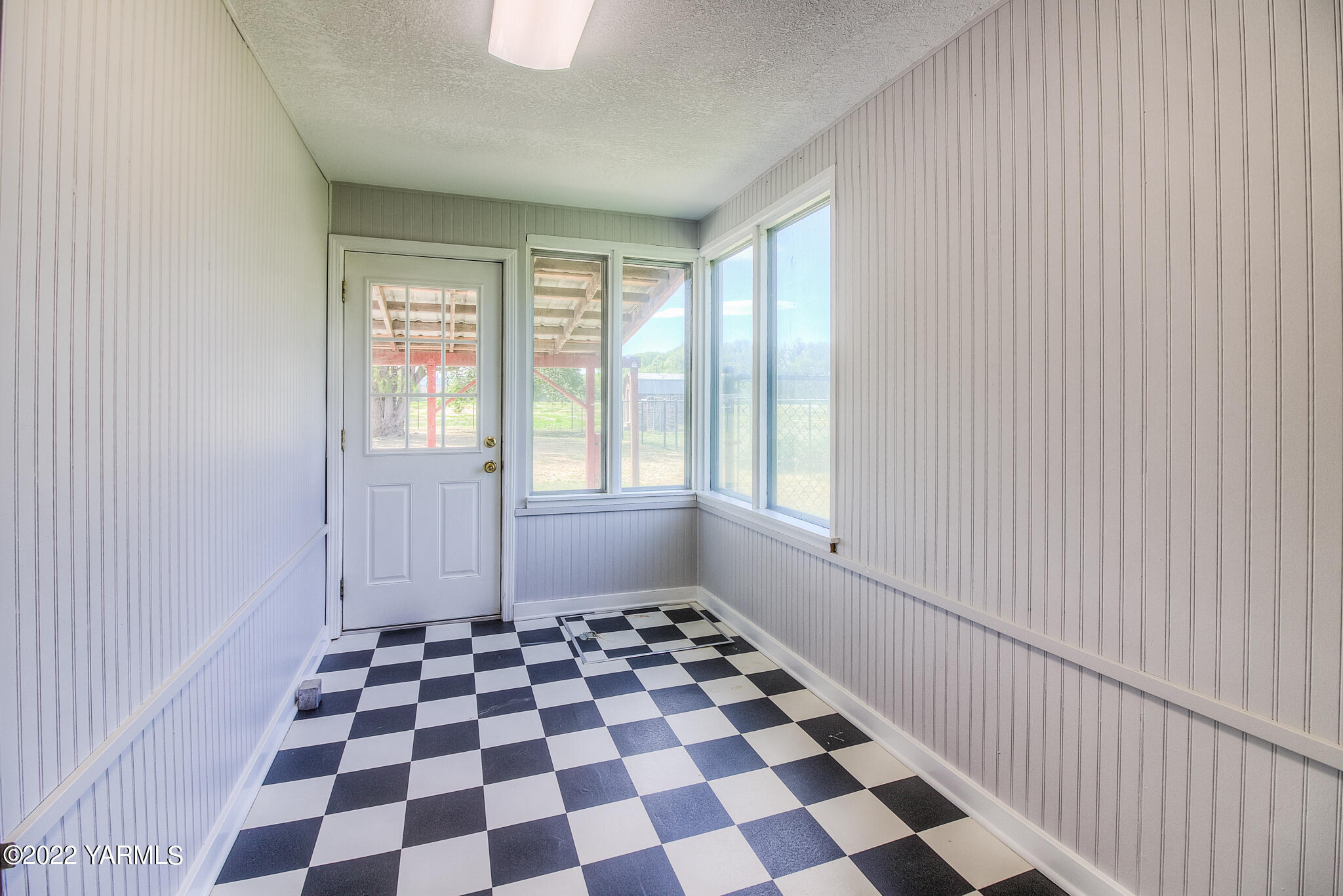 1212 Dazet Road Yakima, WA 98908 - Photo 9 of 37 a view of a room with a black and white checkered floor